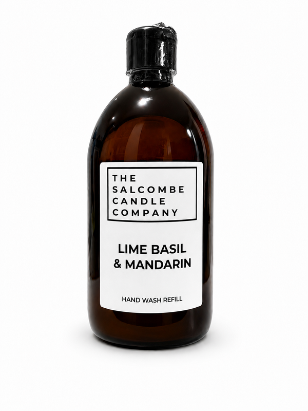 An amber hand wash refill bottle with a black cap and a white label reading 'THE SALCOMBE CANDLE COMPANY' and 'LIME BASIL & MANDARIN HAND WASH REFILL'.