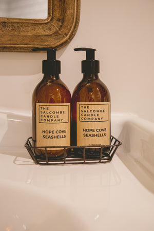 The Salcombe Candle Company Hope Cove Seashells Hand & Body lotion on a sink